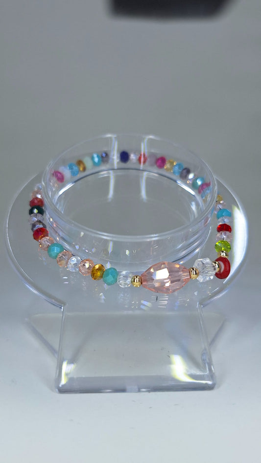 Multicolor crystal bracelet with Turkish eye and white cube.
