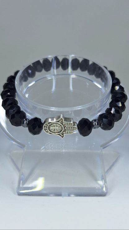 Black crystal bracelet, with Hamsa and St. Benedict Hand charm and ball separators.