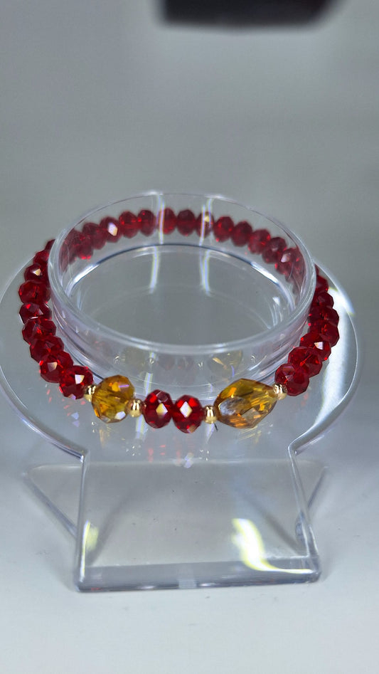 Red crystal bracelet, with crystals and laminated gold divider.