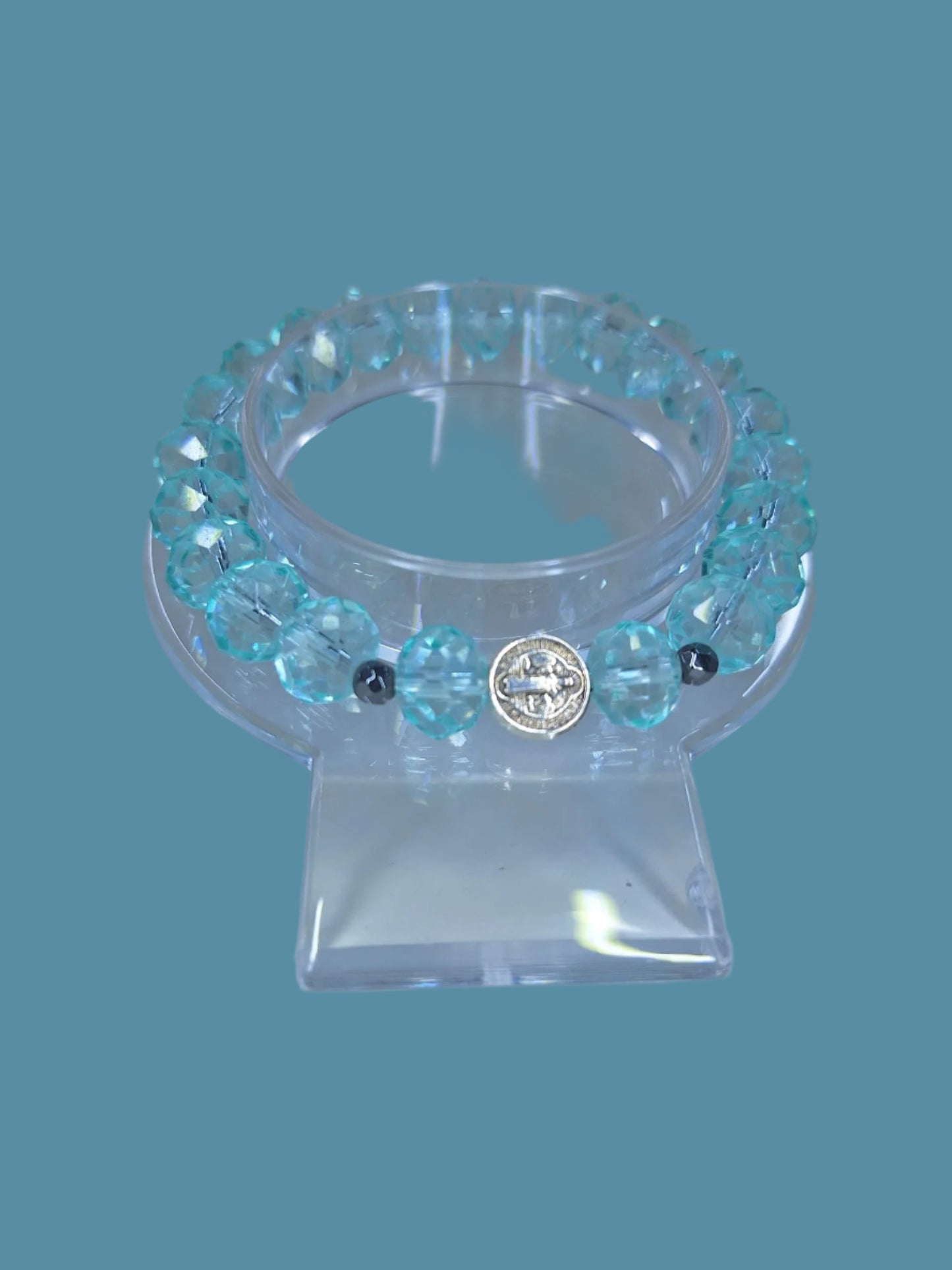 Blue crsytal bracelet with St. Benedict charm.