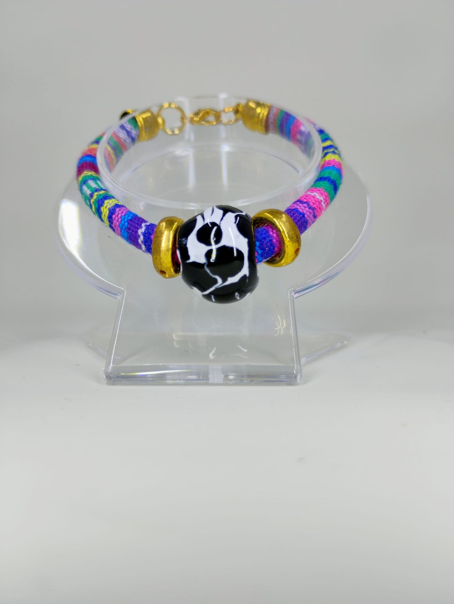 Textile bracelet with Talavera ball charm.