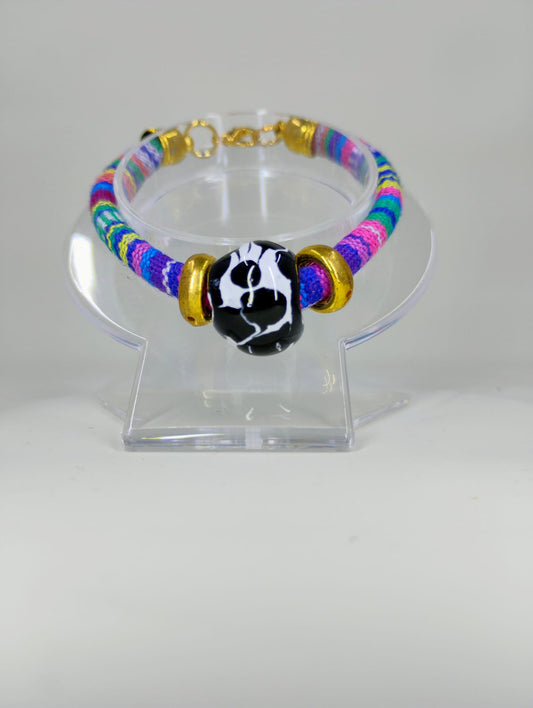 Textile bracelet with Talavera ball charm.