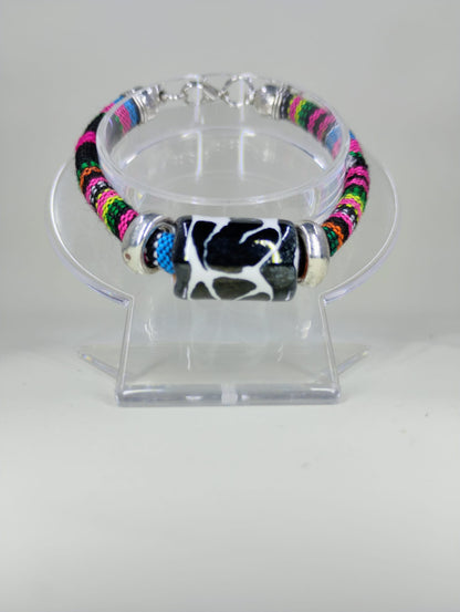 Textile bracelet with Talavera cylinder charm.