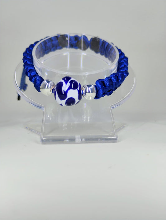 Hand-knitted bracelet with Talavera charm.